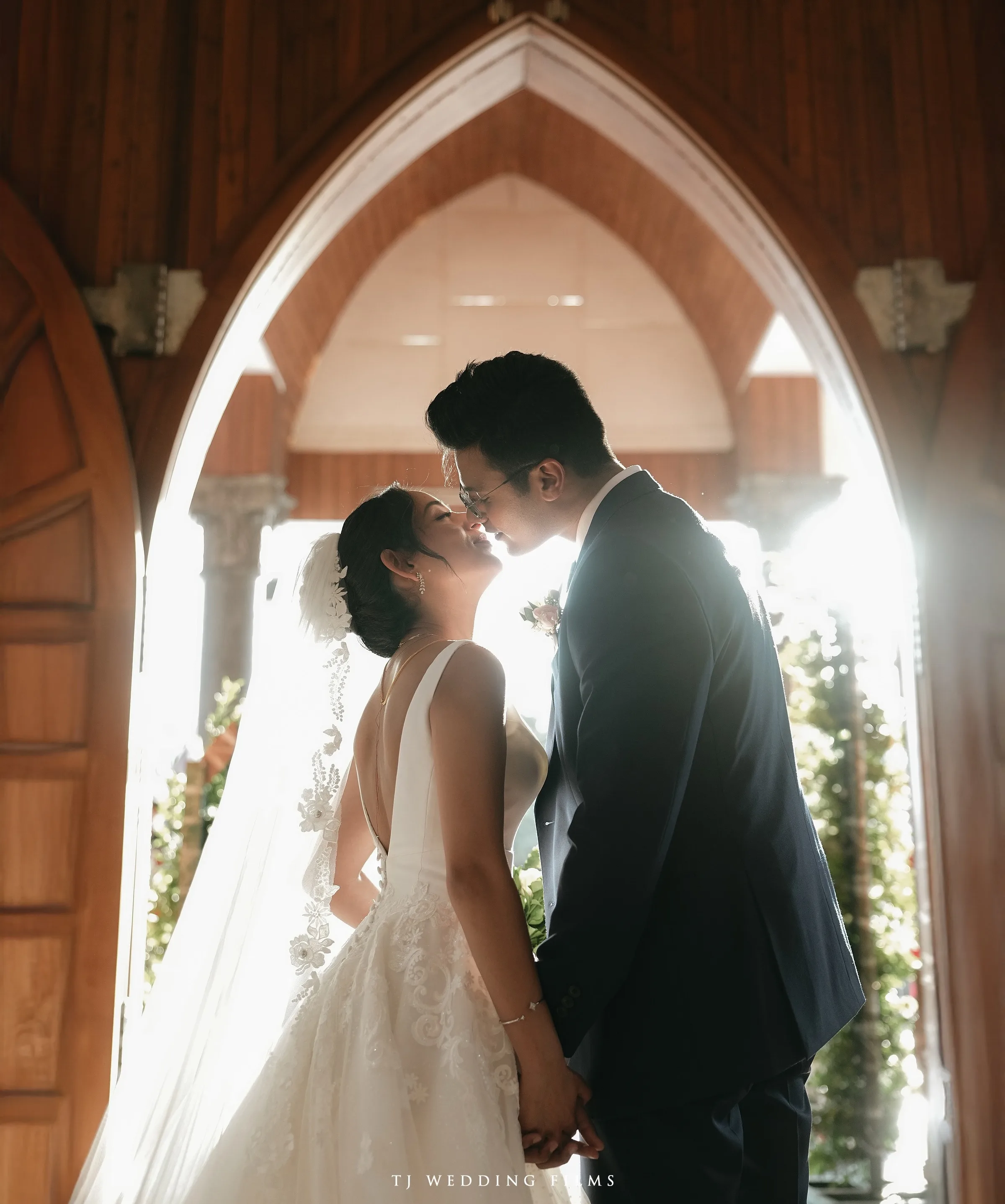 A couple sharing a gentle wedding moment